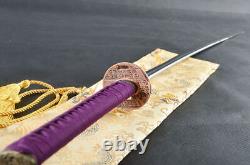 Épée japonaise de samouraï fonctionnelle en acier damassé plié, prête pour la bataille.