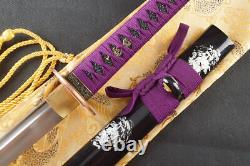 Épée japonaise de samouraï fonctionnelle en acier damassé plié, prête pour la bataille.
